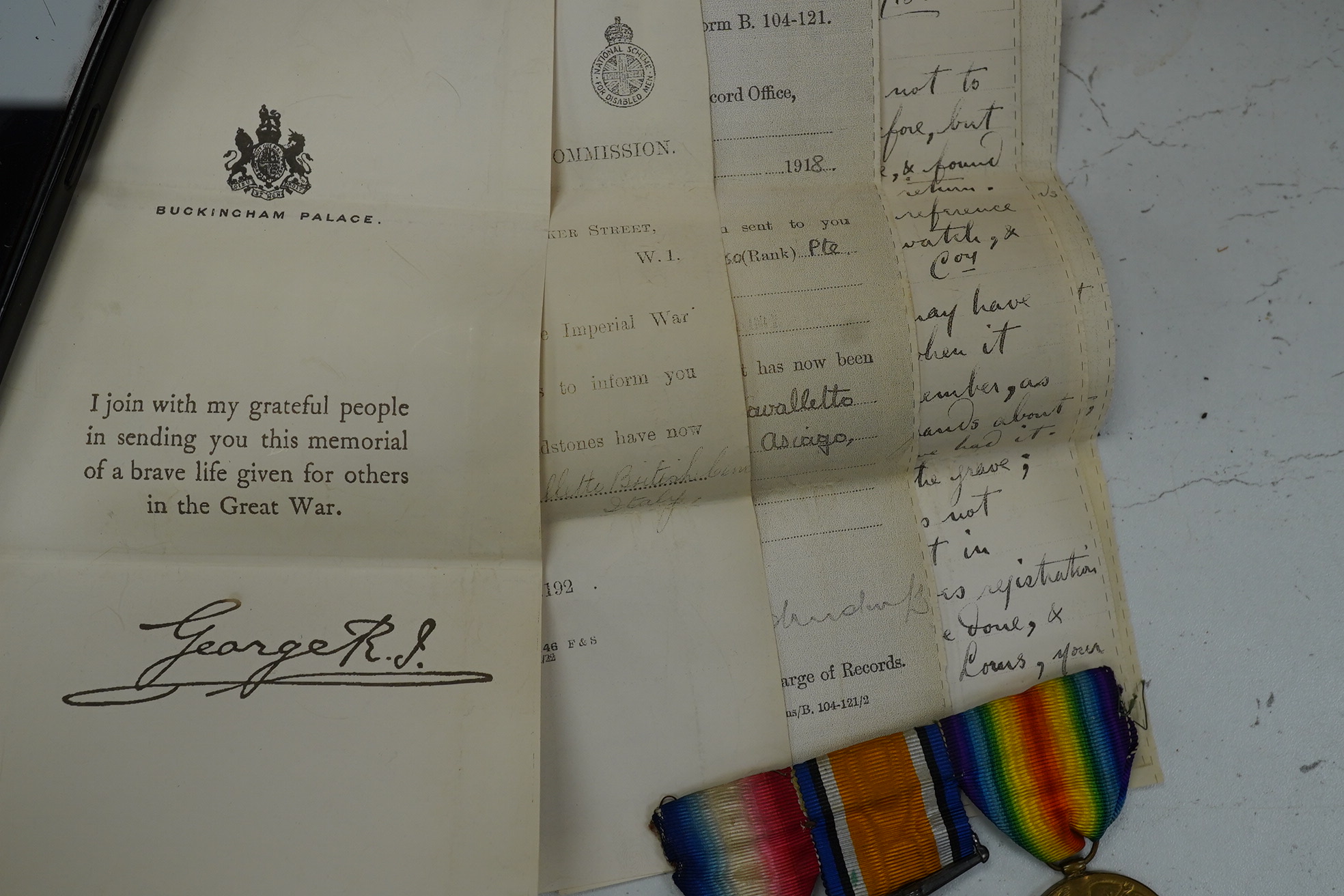 A First World War medal trio awarded to Pte. J. Ball Oxf. & Bucks. L.I., together with an oak mantle clock inset with a memorial plaque awarded to George John Ball, plus related paperwork. Condition - fair to good